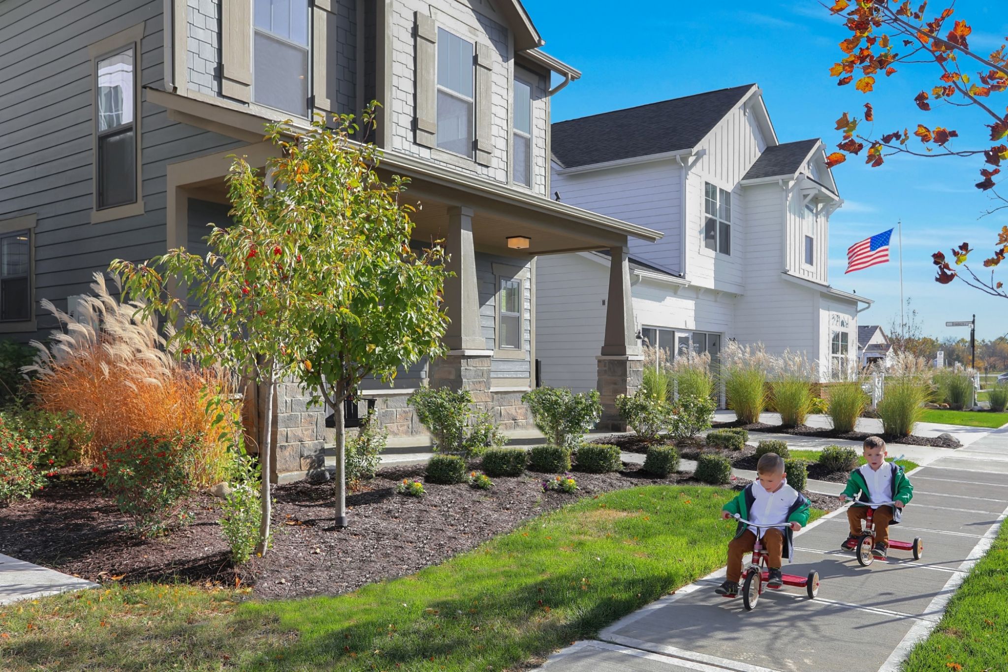 Street View of The Grove at Legacy Community With Children Riding Bikes